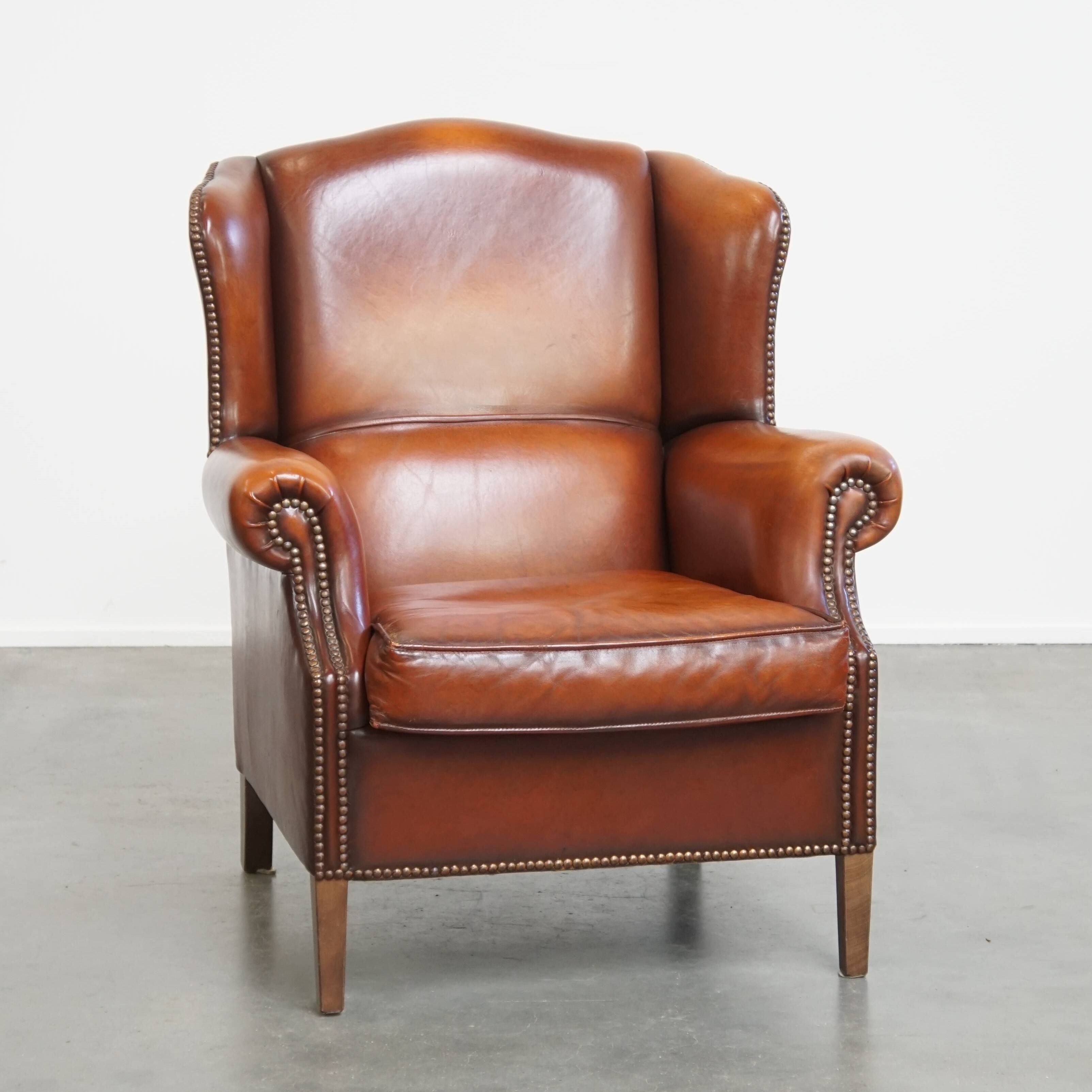 Fauteuil à oreilles en cuir de mouton