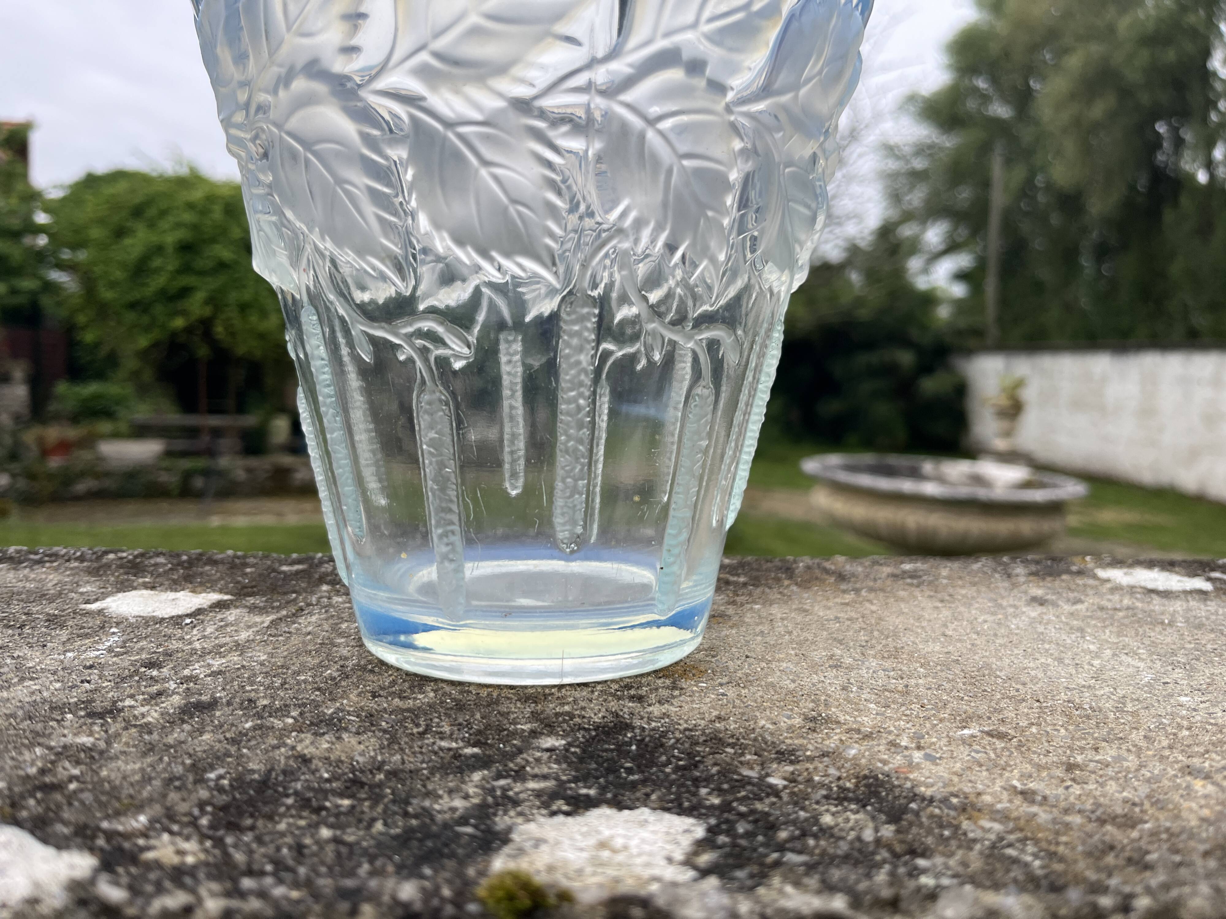 Opalescent glass vase moulded with leaf and catkin decoration – in the style of Lalique.