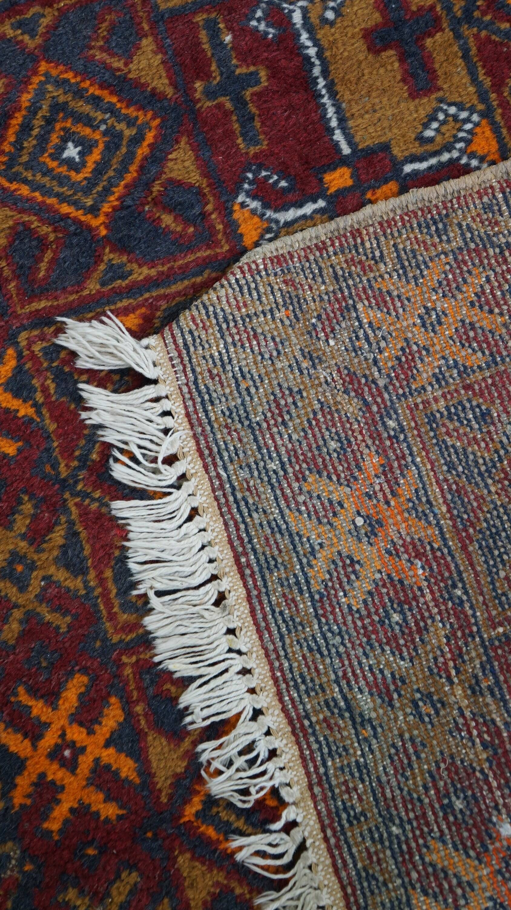 Antique oriental rug featuring orange details 135x81cm