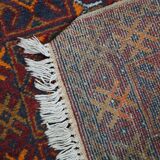 Antique oriental rug featuring orange details 135x81cm