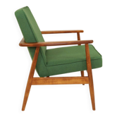 Scandinavian modern chair in green wool, vintage wooden armchair.