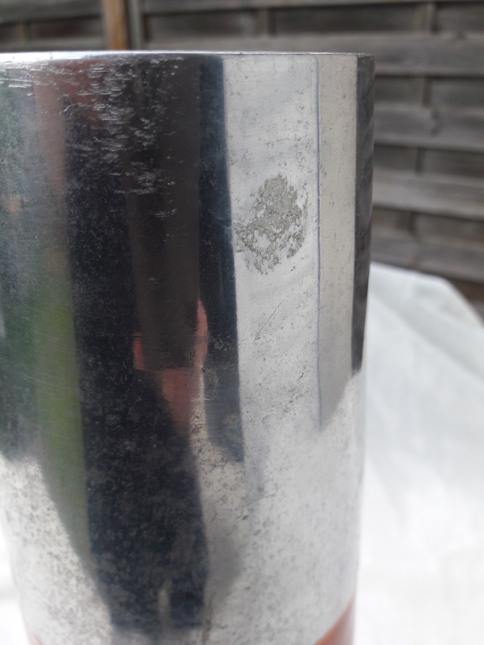 Orange and grey metal vase