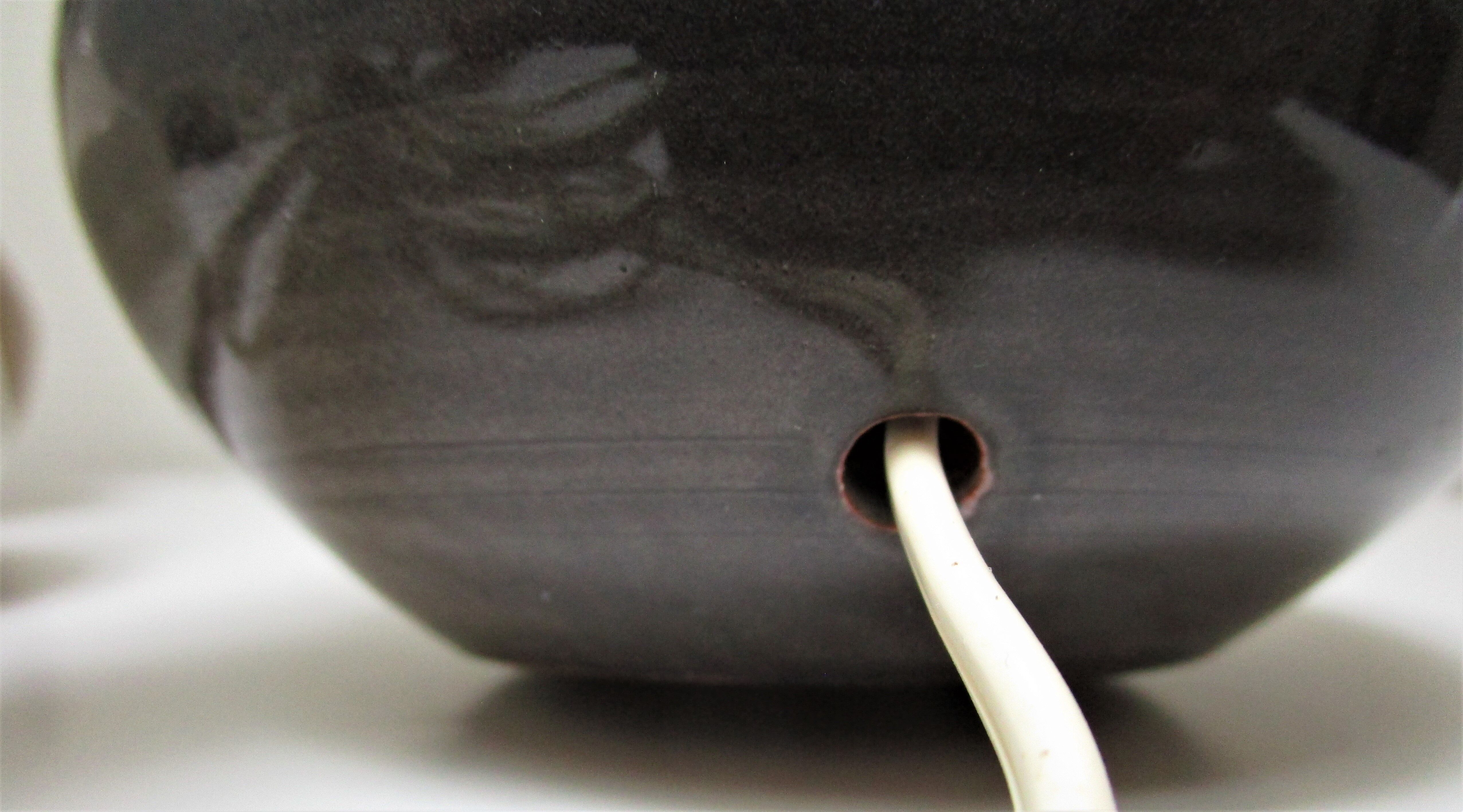 Three vintage ceramic lamps in blue, white and suede