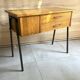 Vintage 1950s sewing machine with blonde oak veneer.