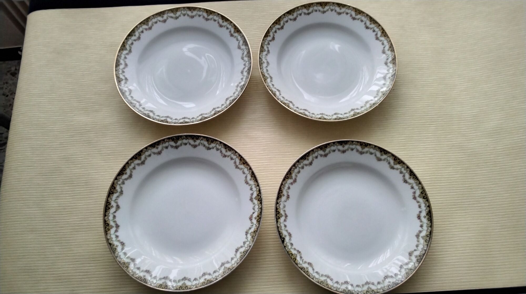 Set of 4 antique hollow plates in Limoges ULM porcelain