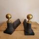 Pair of cast iron and brass chenets