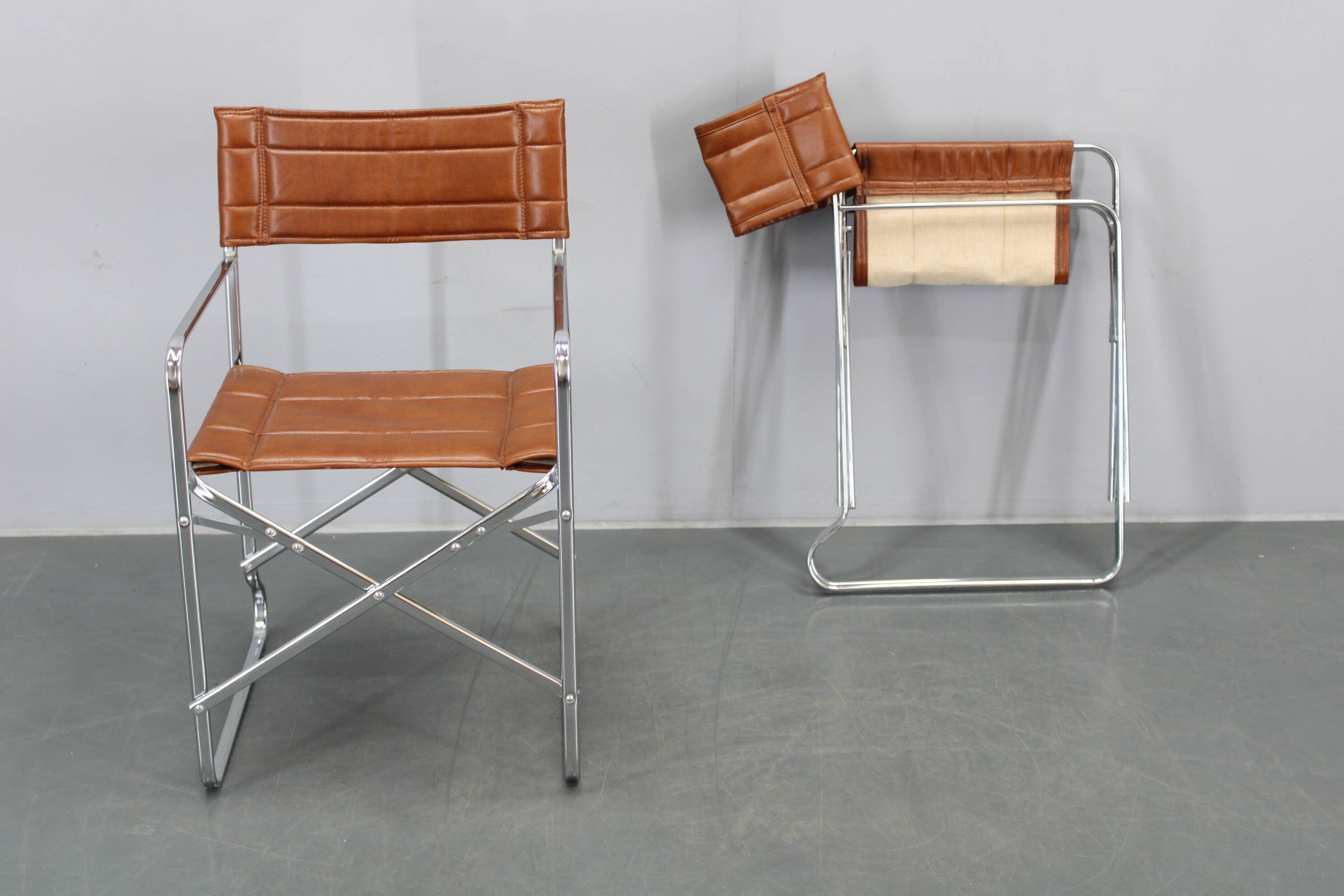 1970s pair of Italian folding chairs with leatherette upholstery