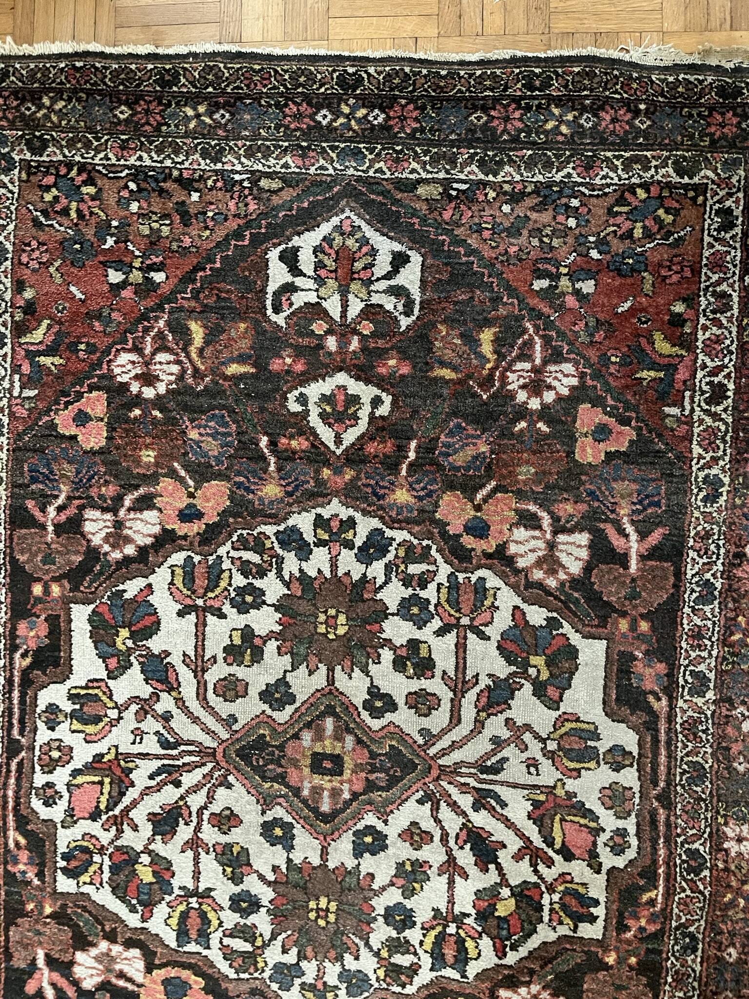 Antique handmade Hamadan Persian rug, ivory medallion on dark background 148x103.