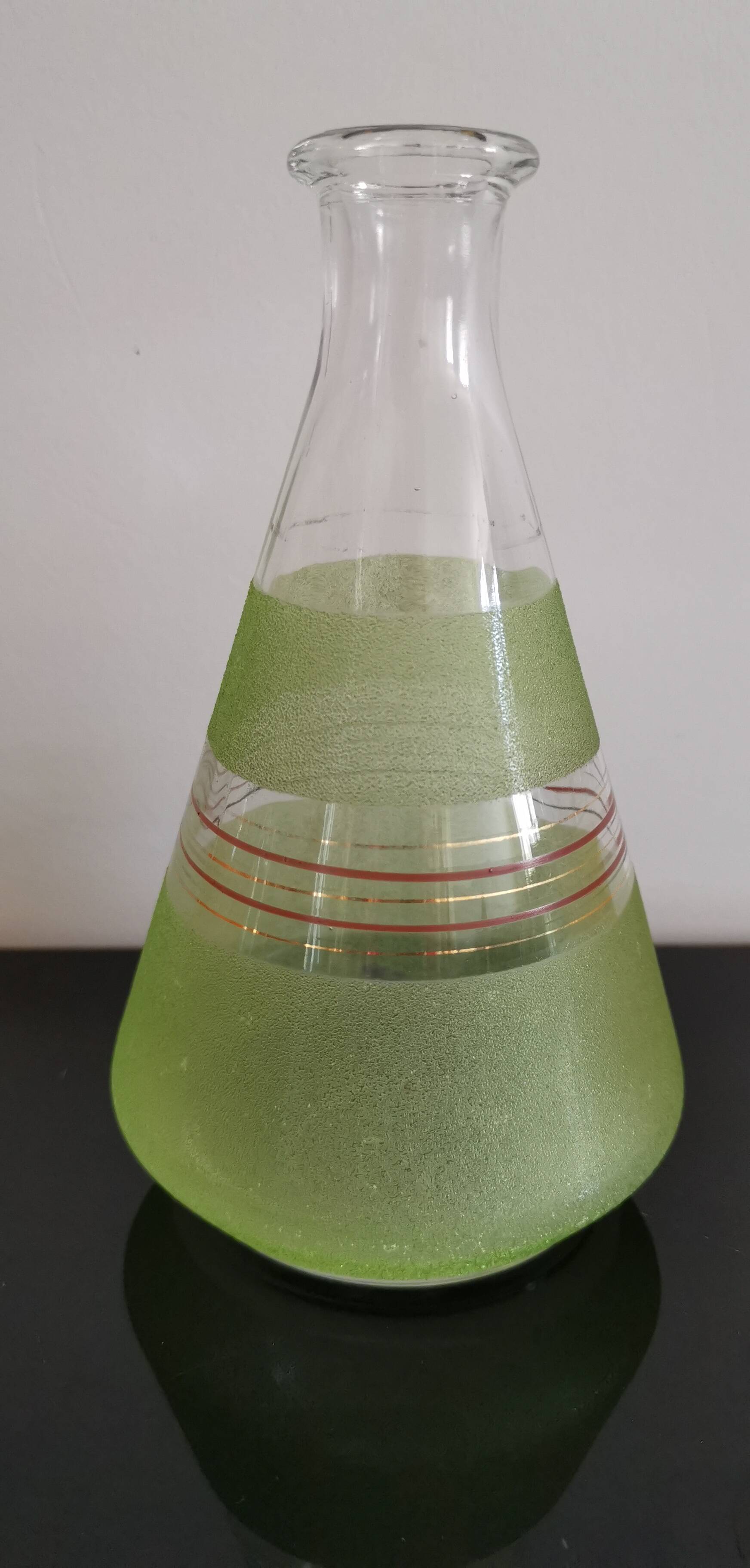 Set of 4 colored granite glasses with its carafe