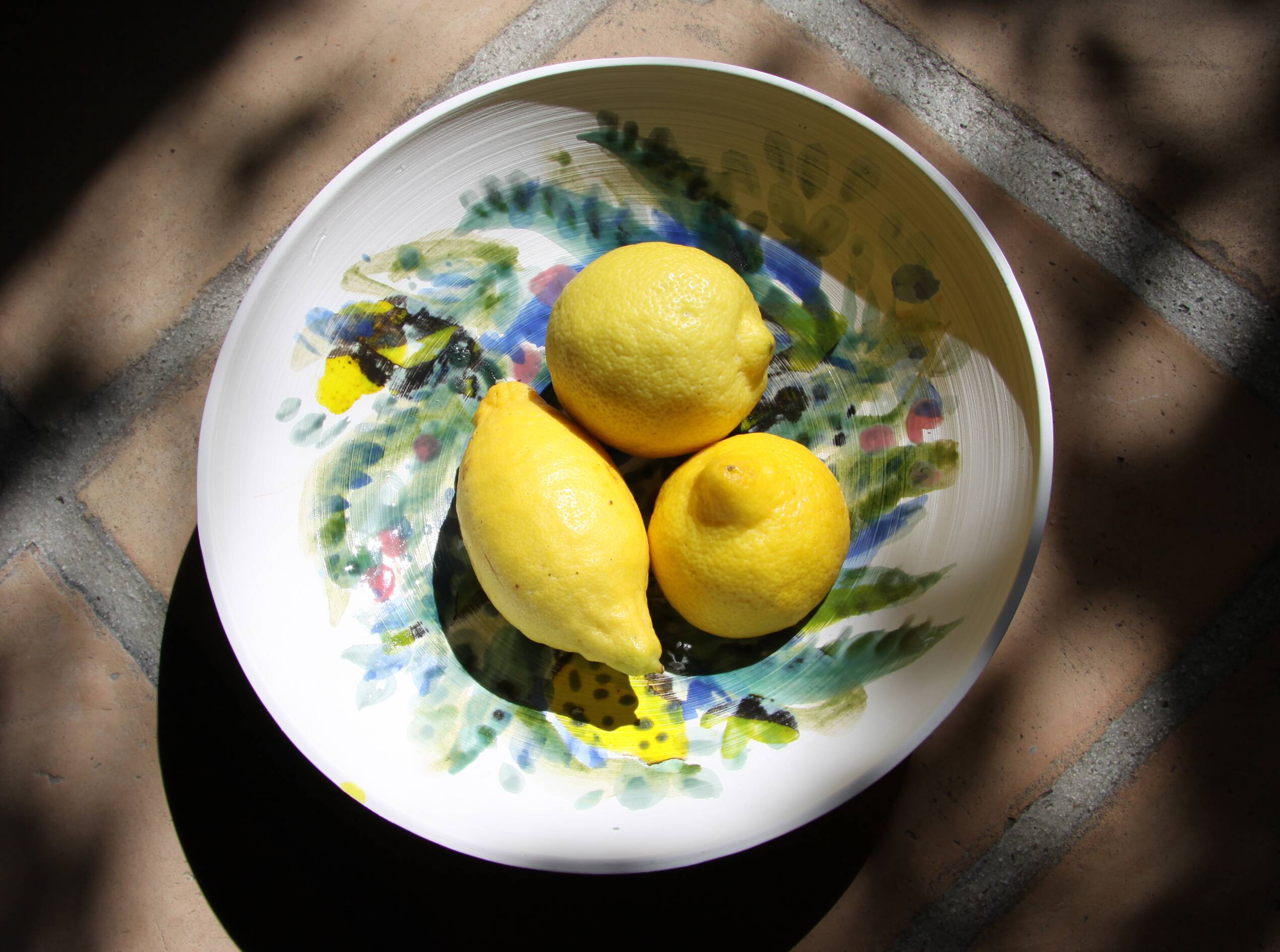 Decorated white earthenware fruit bowl