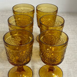 Six stemmed glasses in amber-colored molded glass