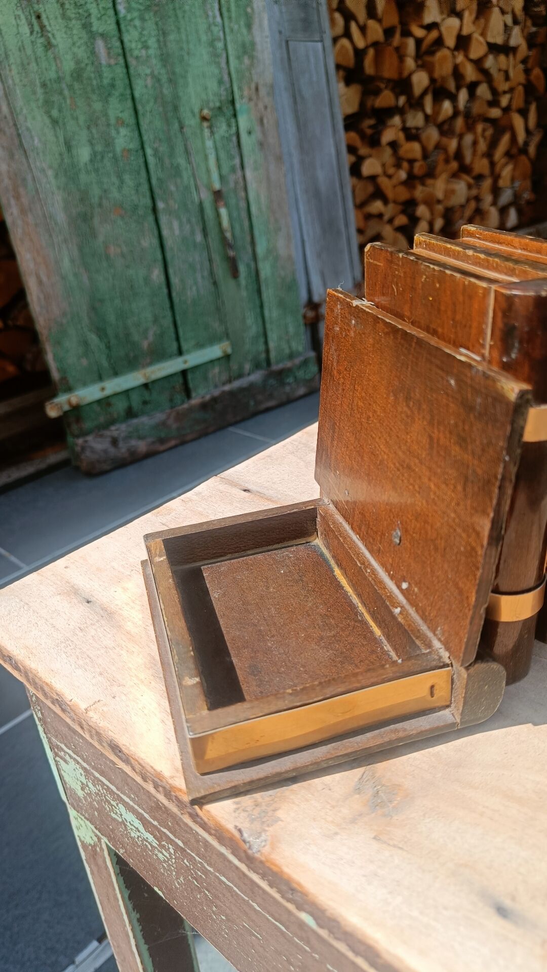 Wooden trompe-l'œil bookends with a book and box