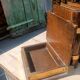 Wooden trompe-l'œil bookends with a book and box