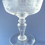 Suite of six champagne glasses on foot in engraved colorless crystal