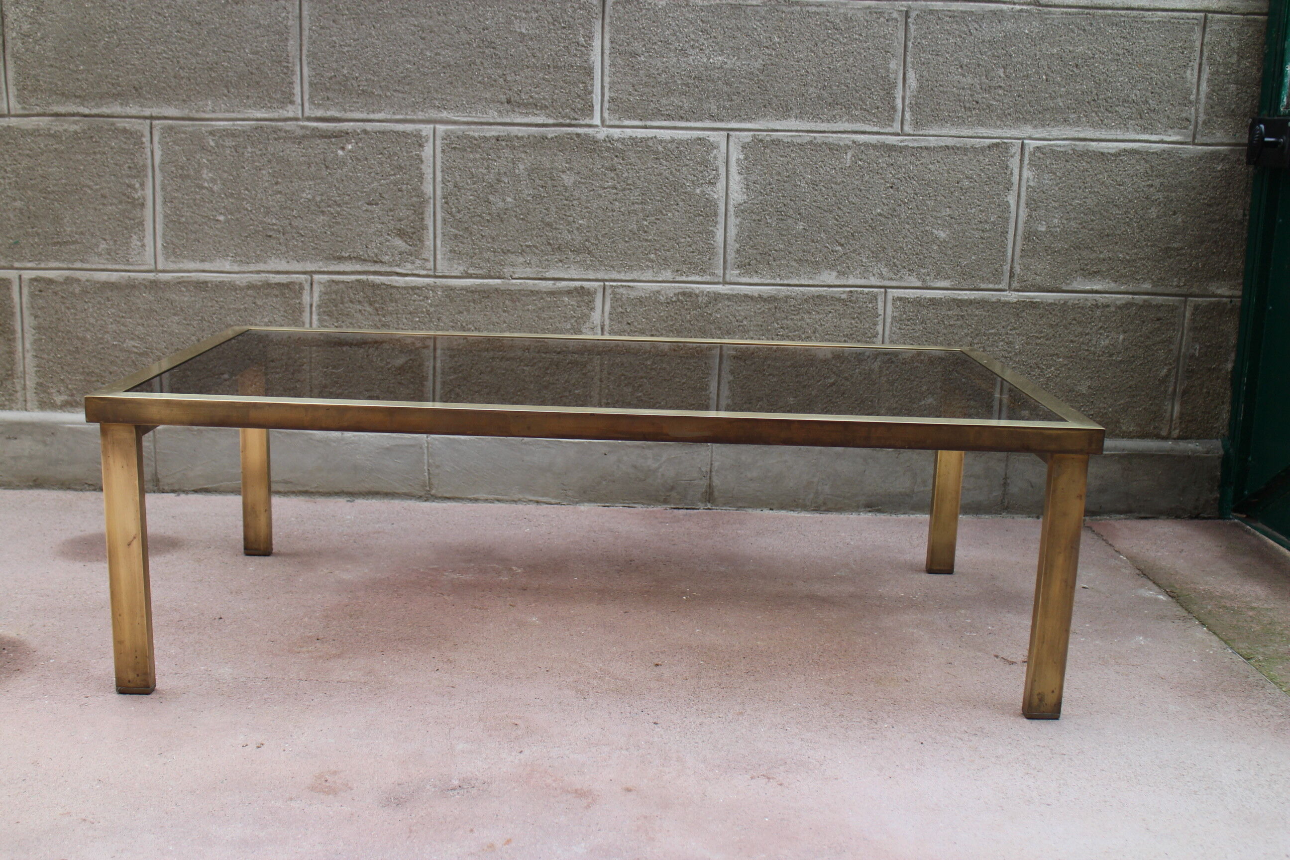 Brass coffee table and 1970 smoked glass