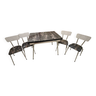 Table and 4 chairs in Formica.