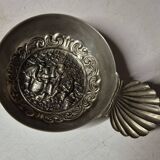 Antique silver-plated metal tastevin with tavern scene decor and shell handle