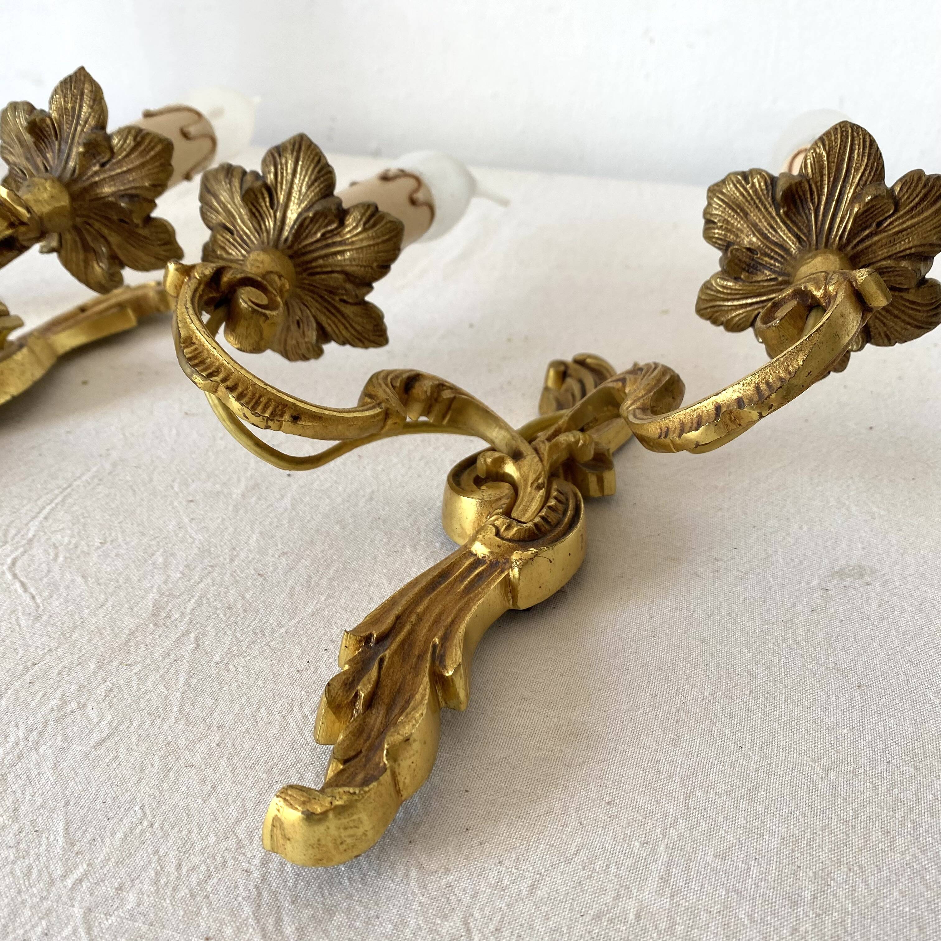 Pair of golden rococo-style wall lights