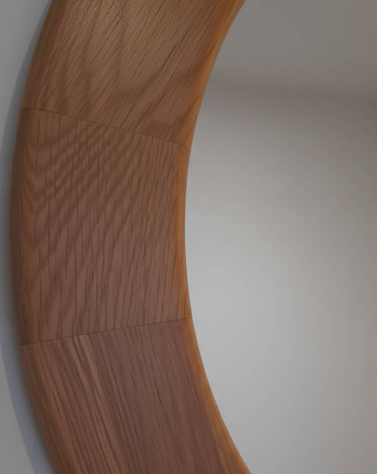 Round wall mirror made of solid wood