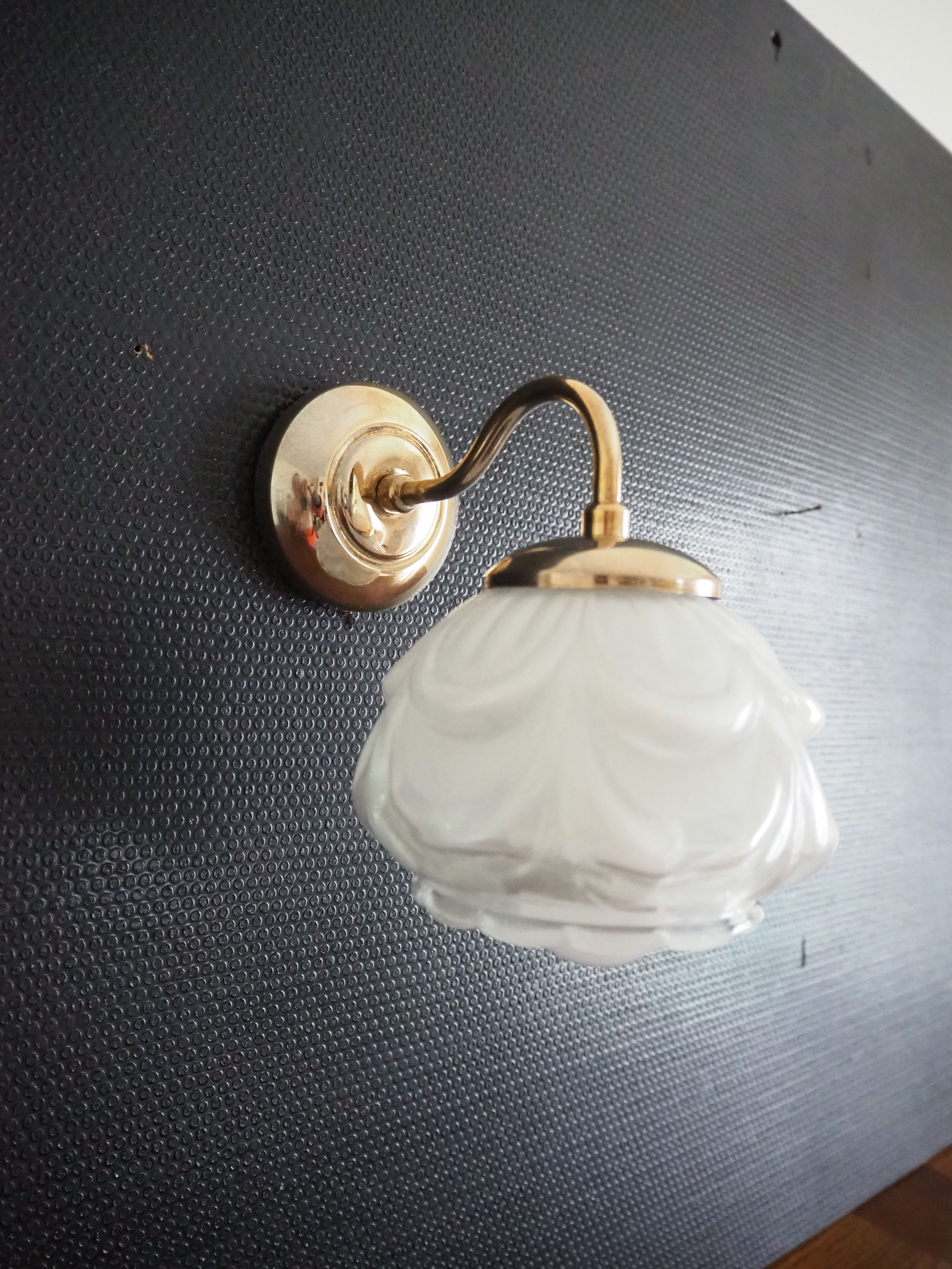 Brass wall lamp and white glass globe from the 1950s-1960s.
