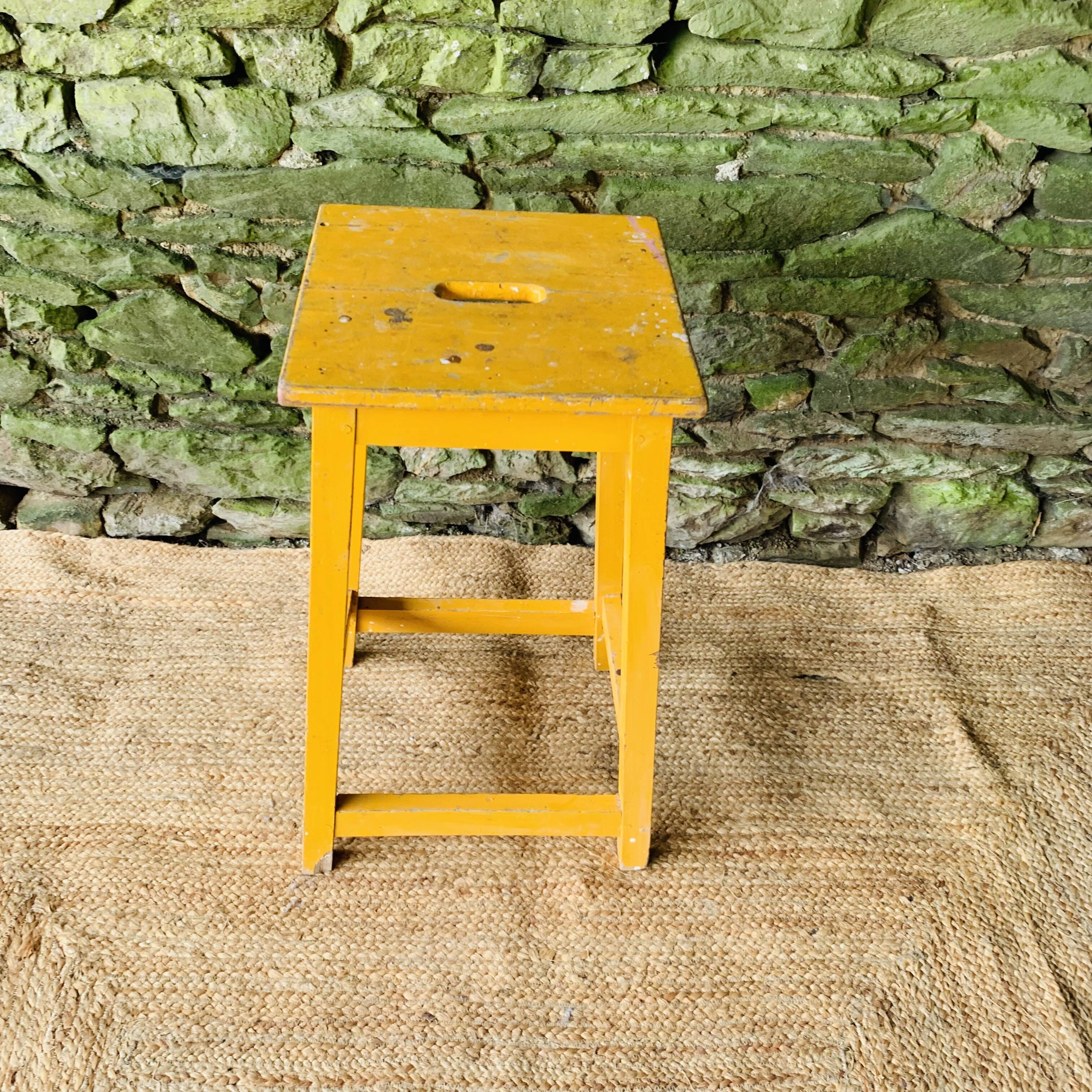 Yellow wooden high stool