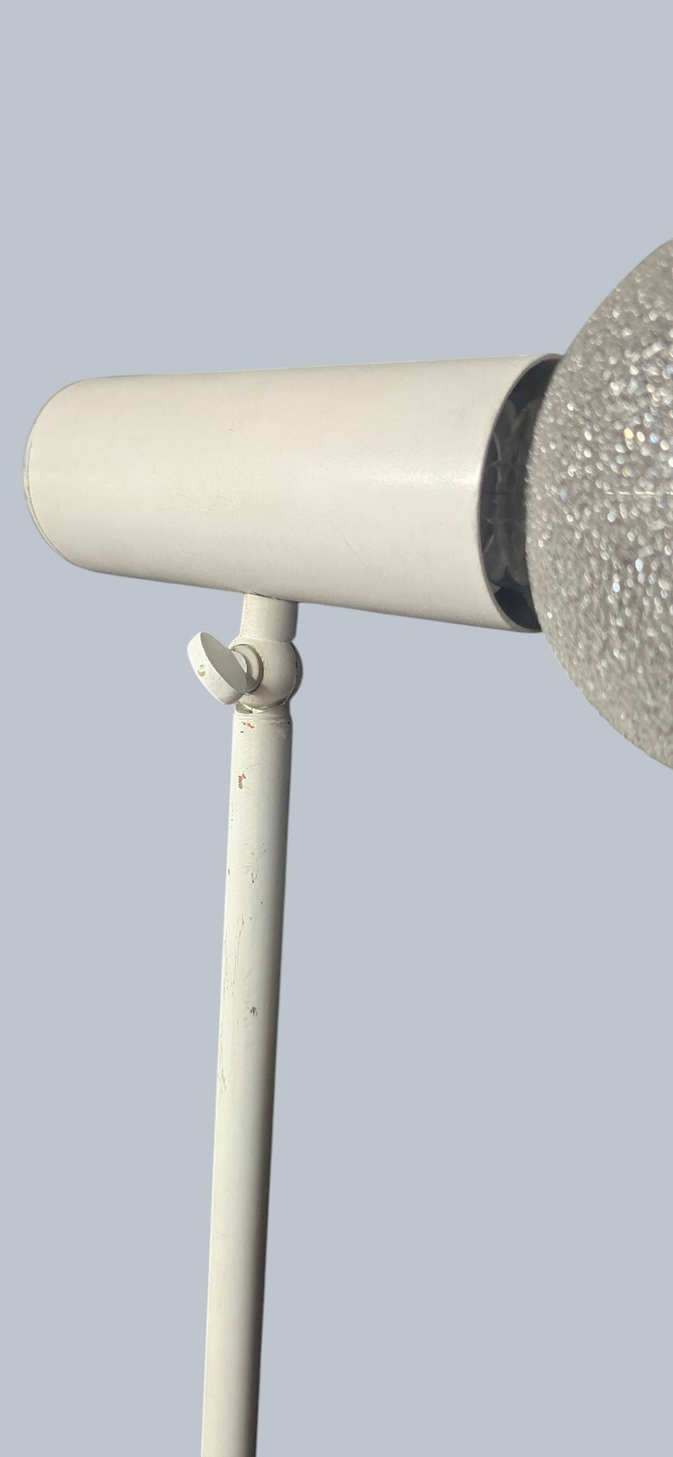 Minimalist metal wall light in the style of Jean Prouvé, circa 1950.
