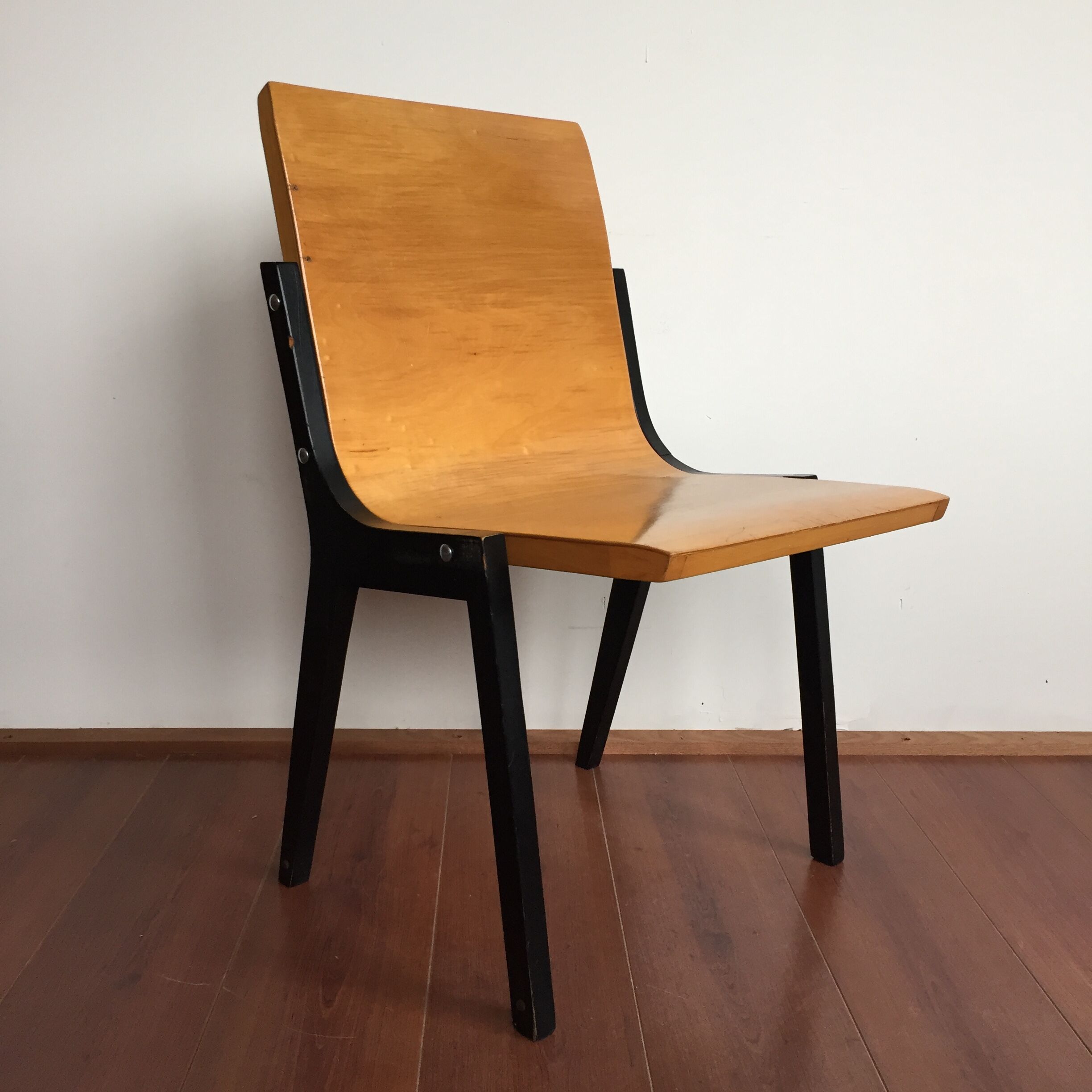 1950s church or school chairs in beech plywood and black stained wood by Roland Rainer