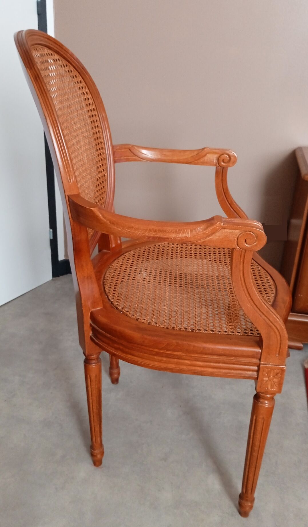 Antique Louis XVI style cane armchair