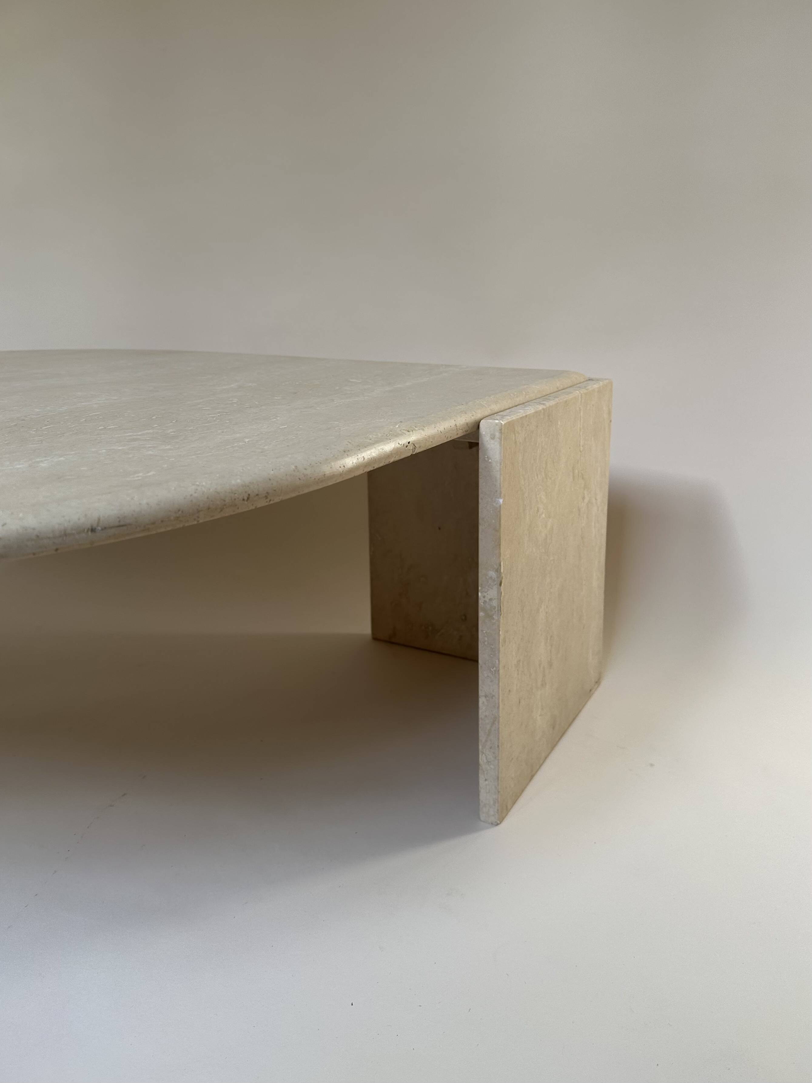 Travertine eye-shaped coffee table