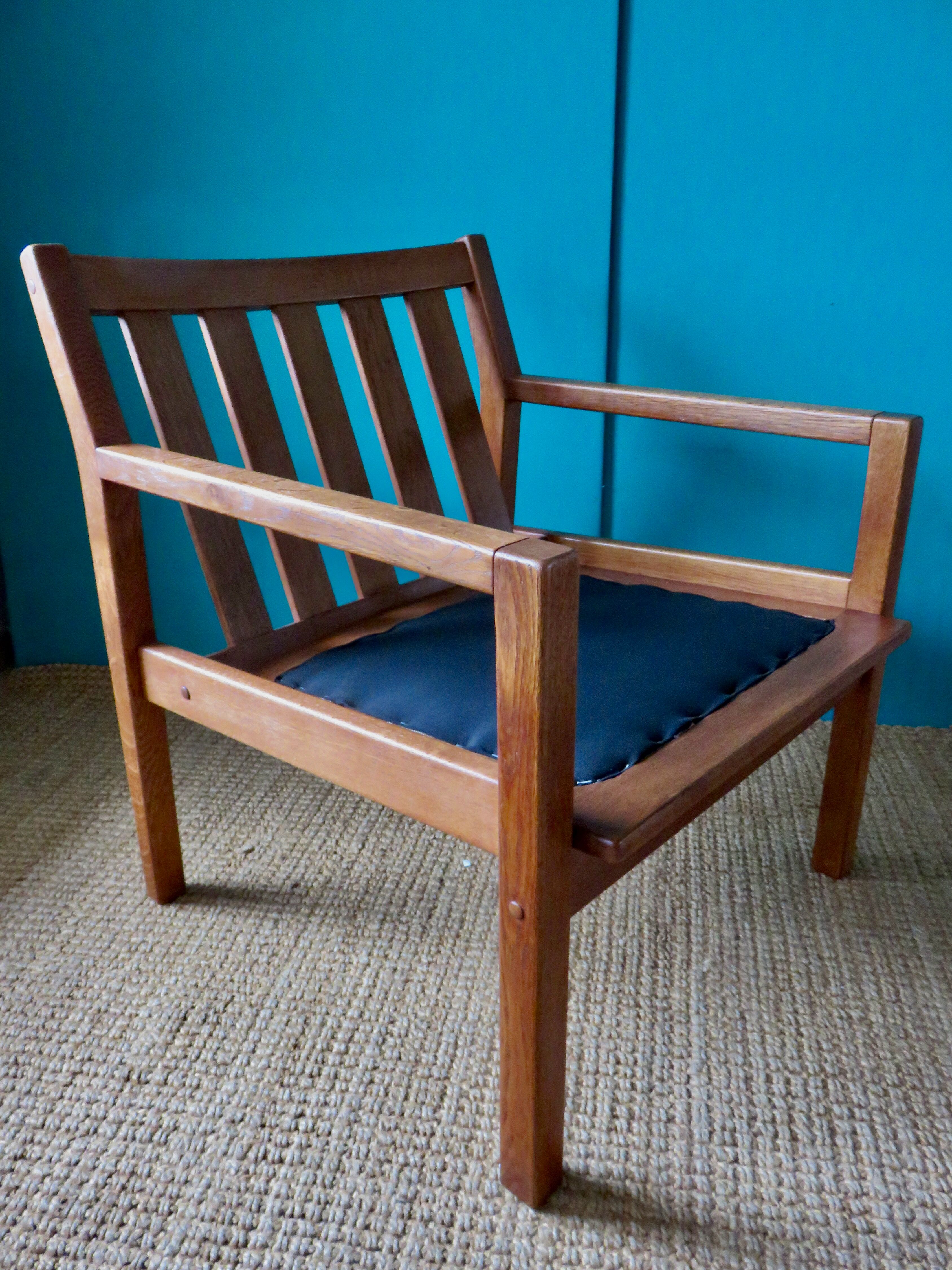 Pair of oak faults with tawny leather cushion. Denmark 1960