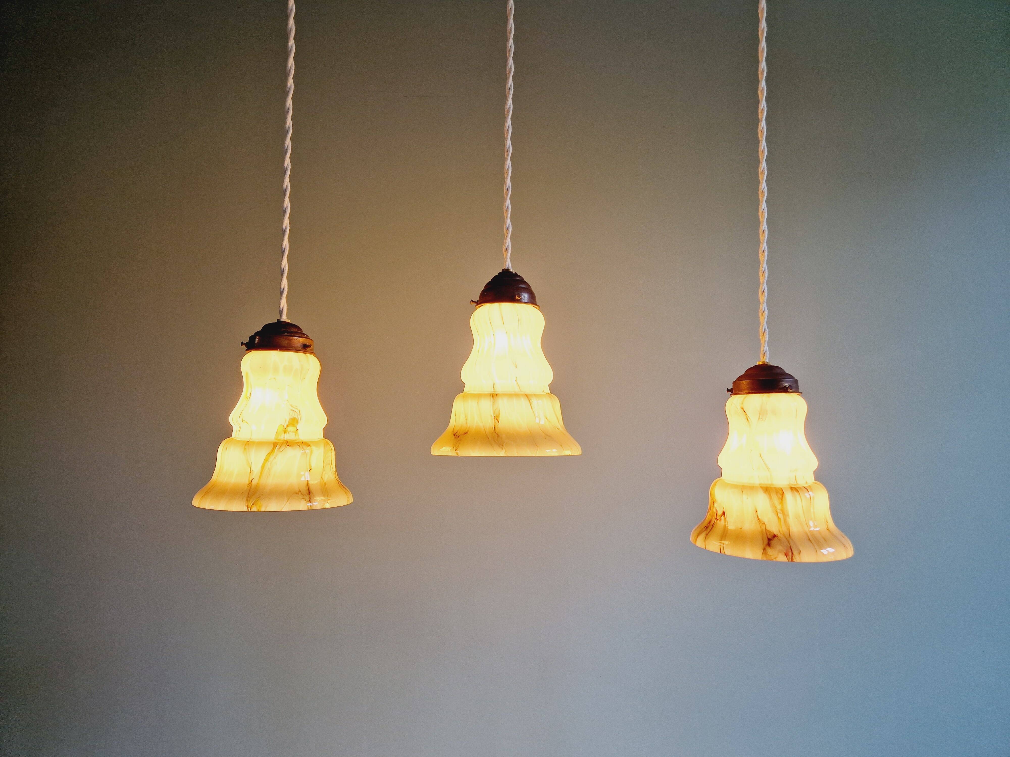 Set of 3 Art Deco marbled opaline pendant lights, 1920s-30s
