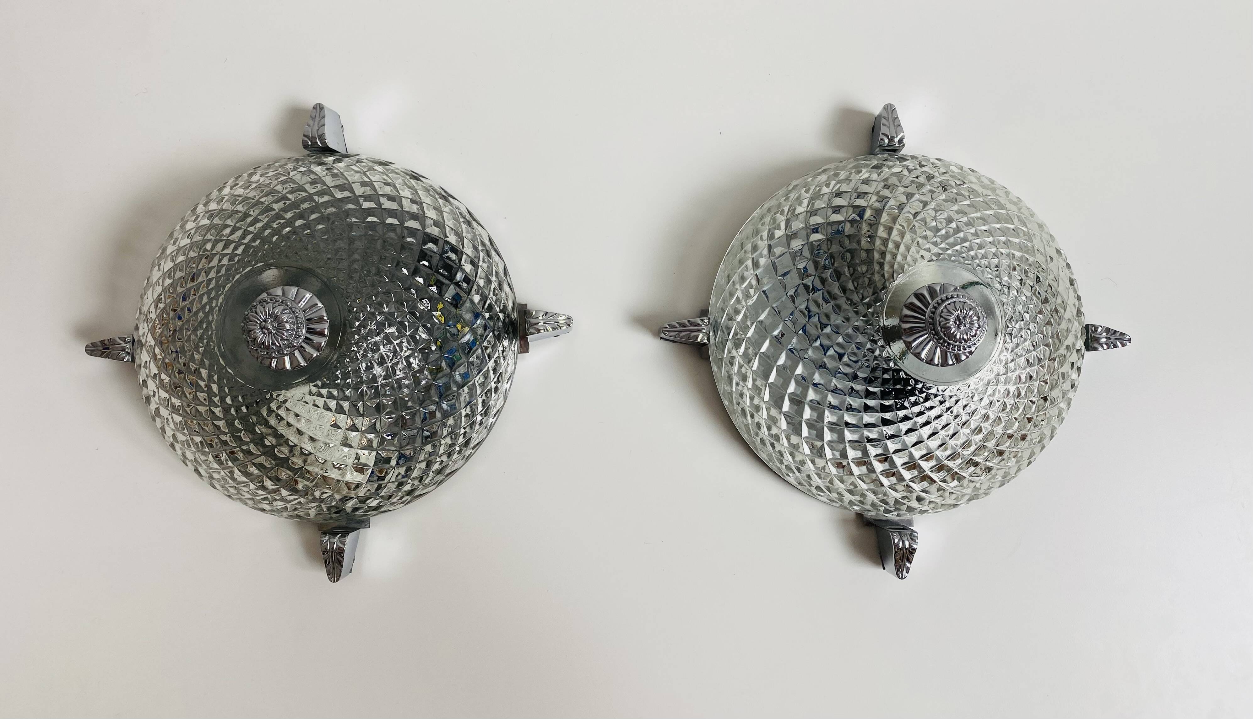 Pair of chrome-plated glass sconces