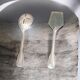 A pair of vintage silver-plated metal serving cutlery (shell).