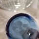 Small blown blue glass bottle
