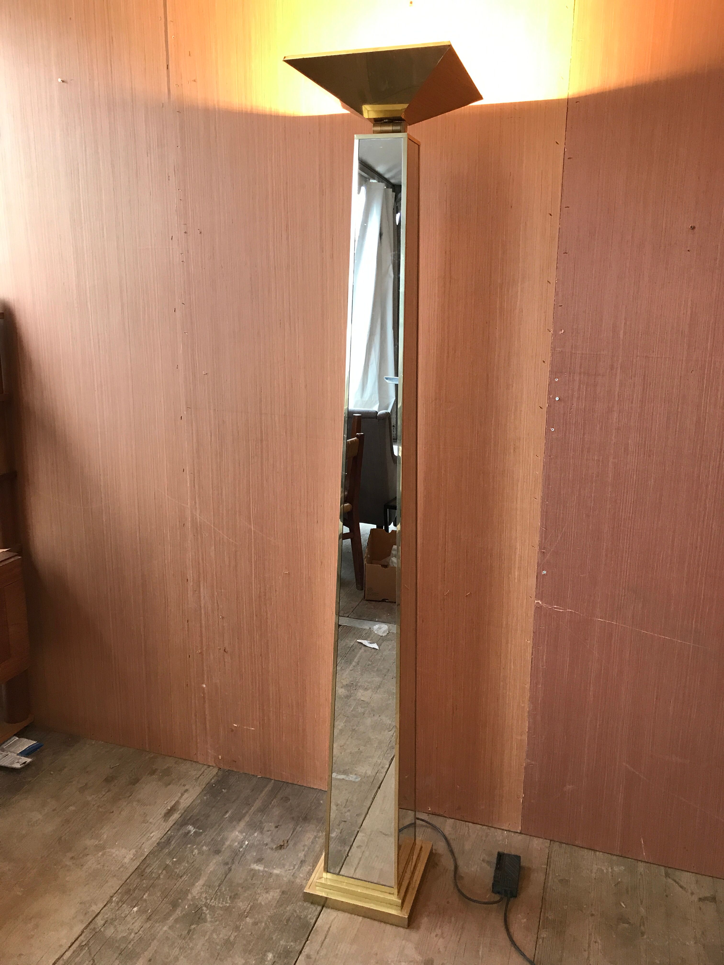 Mirror and gold metal lamppost