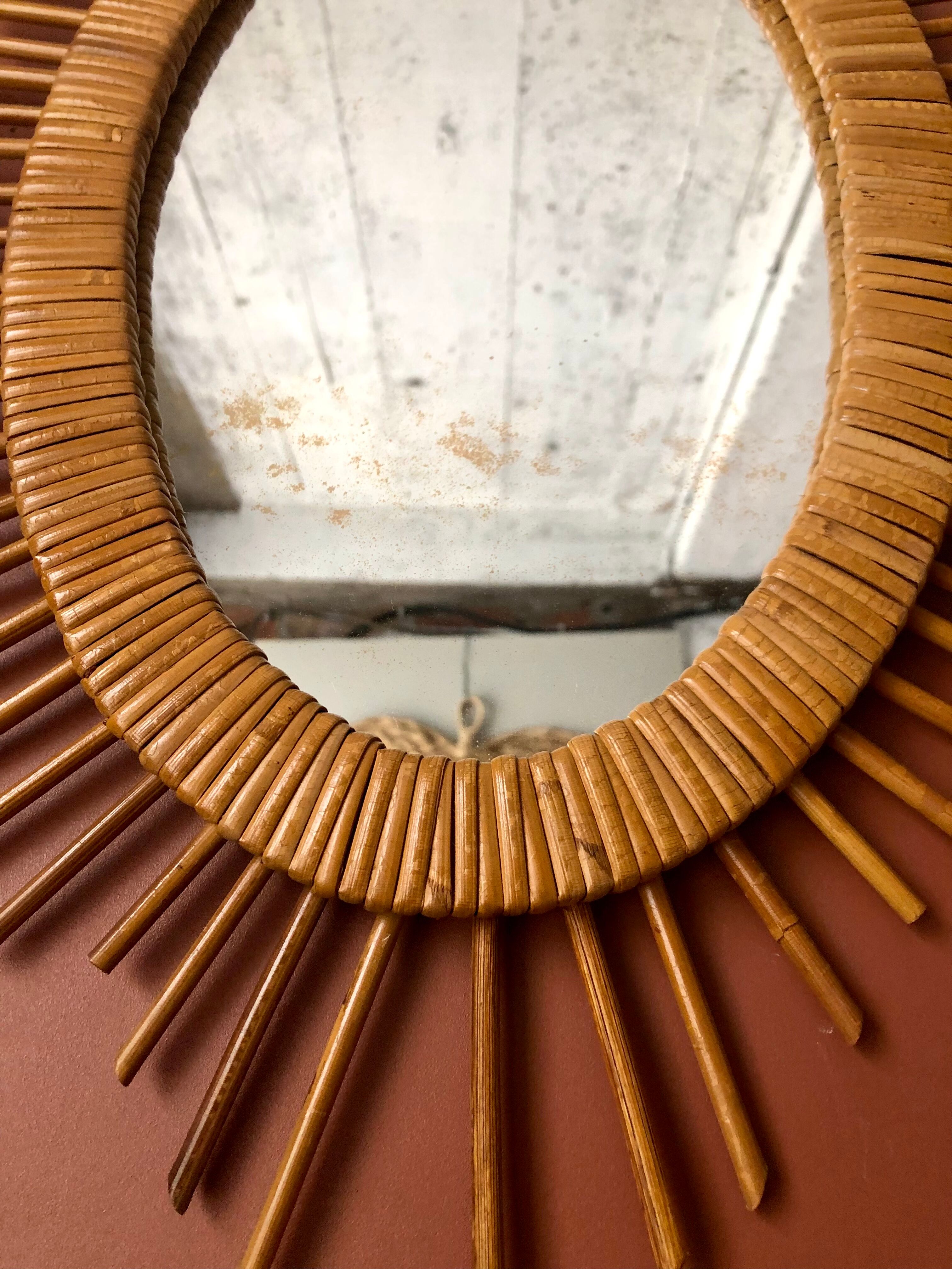 Oval rattan sun mirror