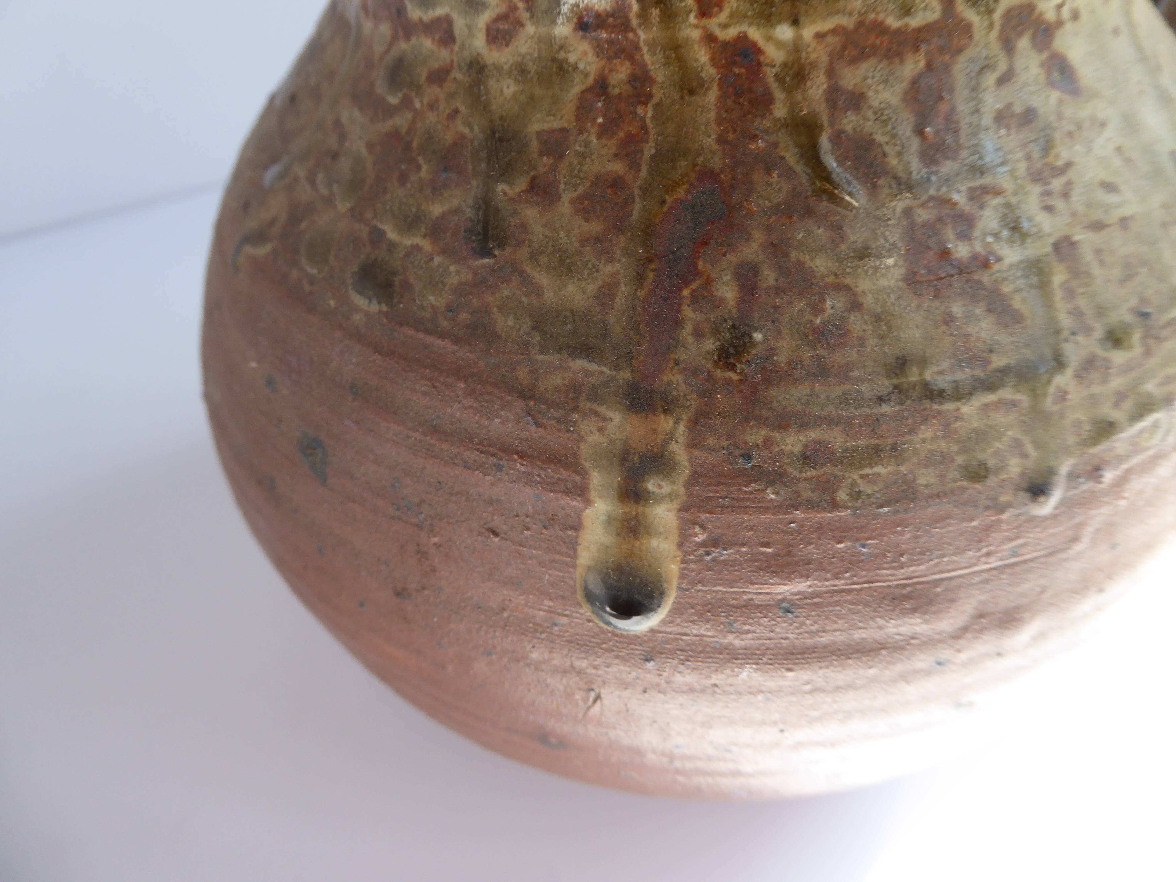 Signed vernissé sandstone pitcher