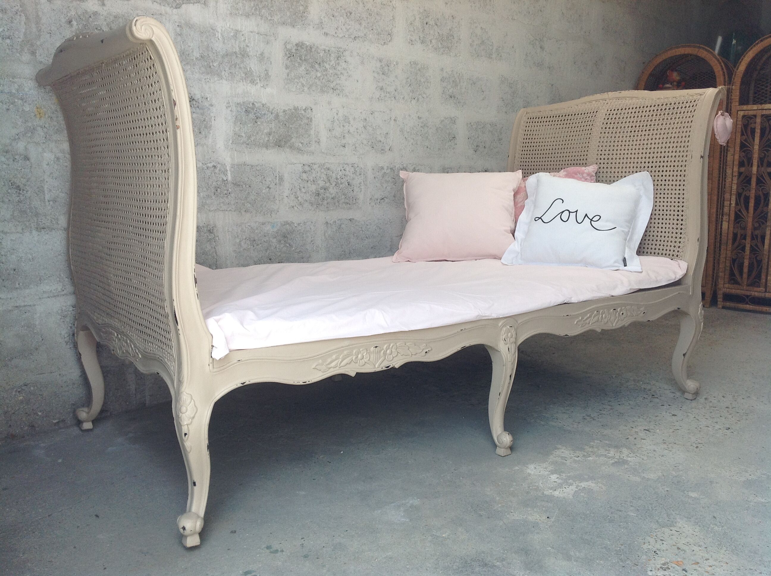Carved wooden bench and caning bed