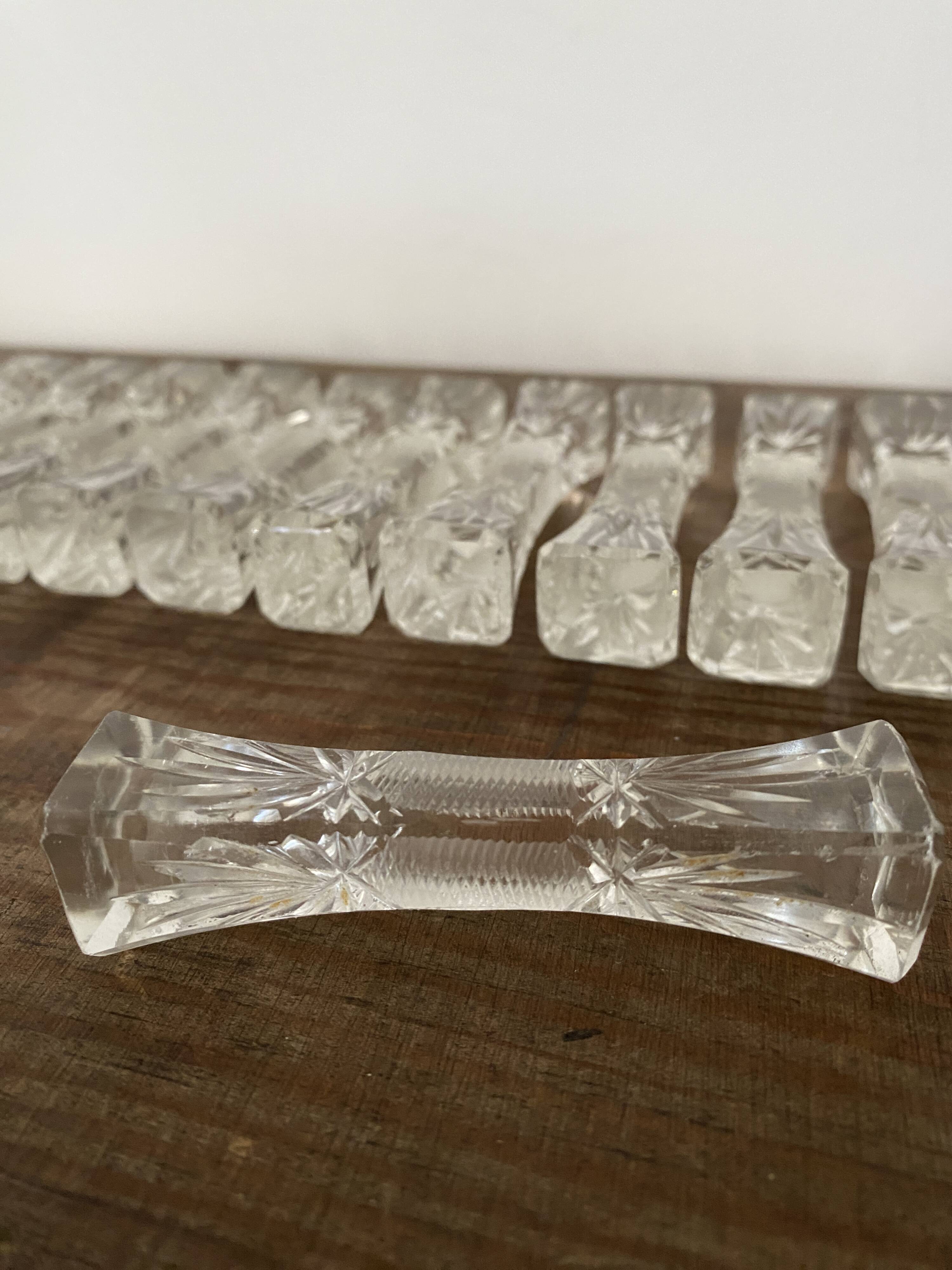 12 vintage knife holders in cut crystal, "candy", "butterfly" shape