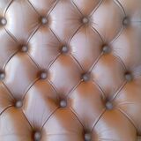 Chesterfield armchair in wood and leather