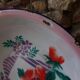 Enamelled sheet metal basin floral decoration