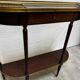 Louis XVI demi-moon console in wood and brass.