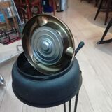 Ashtray with mechanism on foot