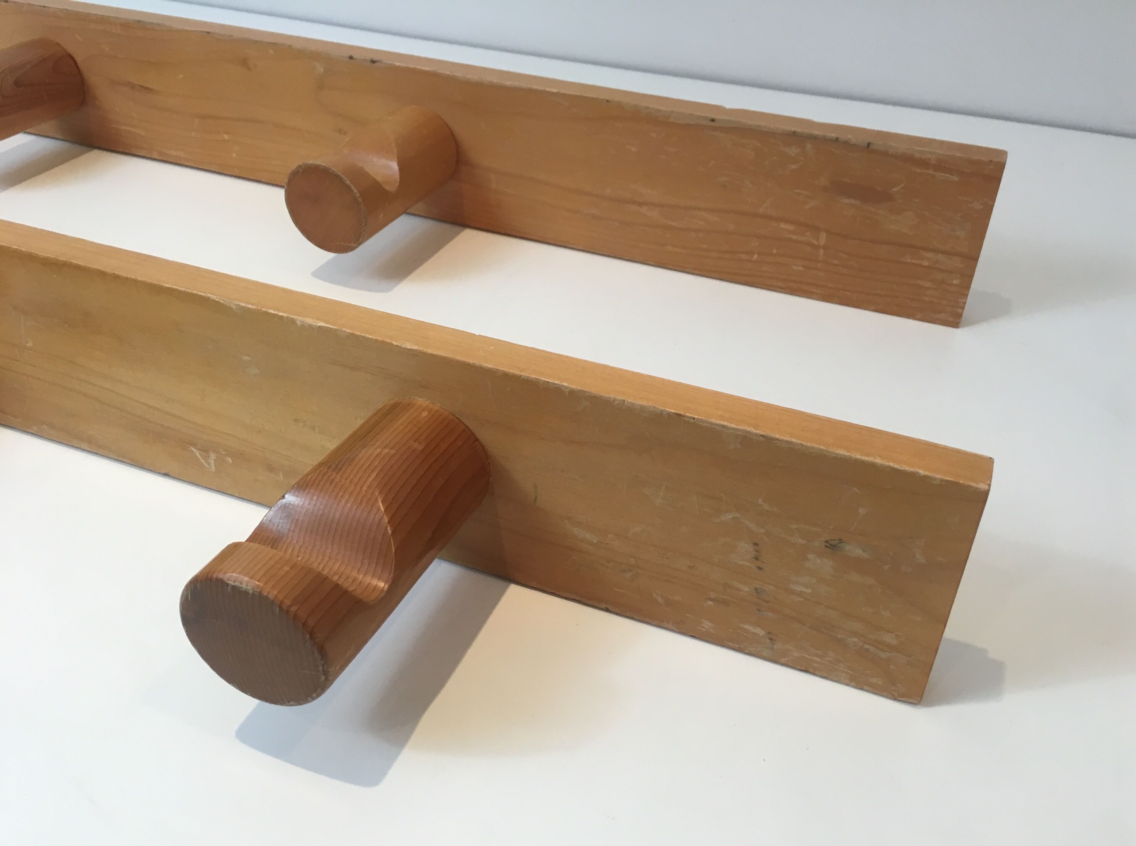 Charlotte Perriand, pair of fir wall coat racks, French work, around 1970