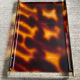 Vintage plateau in tortoiseshell lucite, Maison Mercier style.