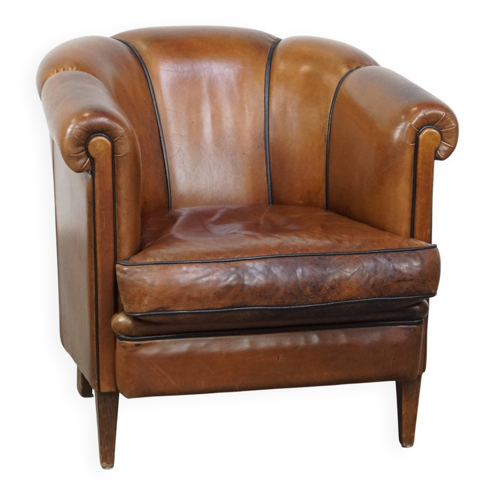 Unique vintage cognac-coloured leather club armchair with black piping