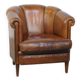 Unique vintage cognac-coloured leather club armchair with black piping