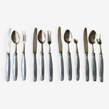 Old dessert cutlery in silver metal