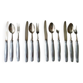 Old dessert cutlery in silver metal