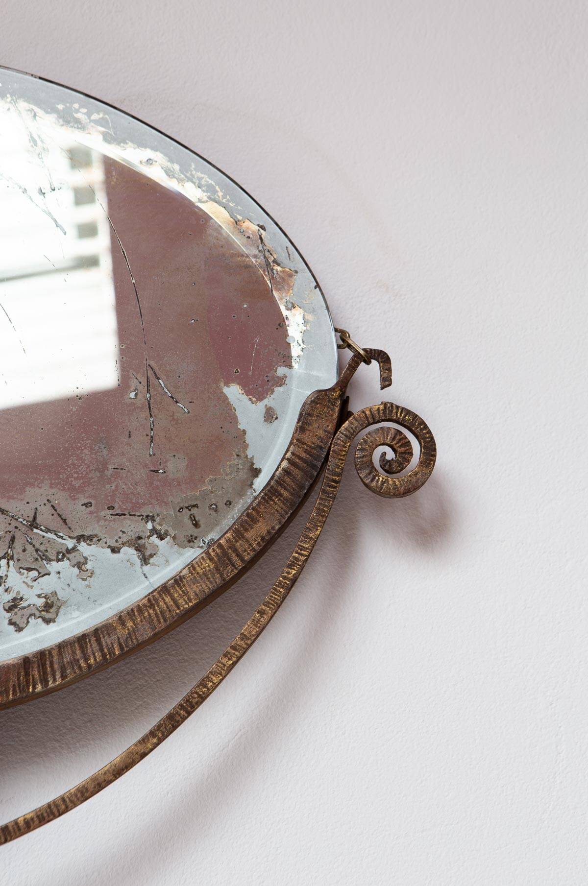 Old wrought iron mirror in the art deco style and period